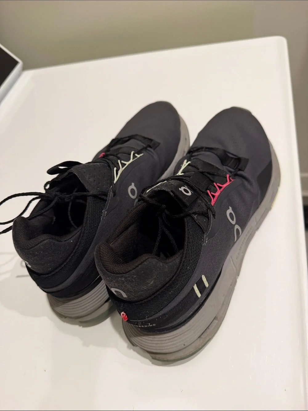 On Running woman’s Black Athletic Shoes with Lime and Pink Accents